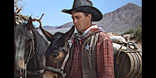 Ben Johnson as a posse member, trying to sort out what destroyed a water tank in Three Godfathers (1948)