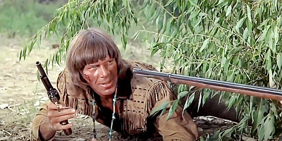 Brad Weston as Driver, one of Remy's men, running into trouble in Barquero (1970)