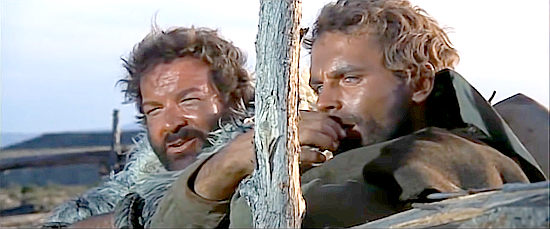 Bud Spencer as Hutch Bessy and Terence Hill as Cat Stevens watch the circus come back to life in Boot Hill (1969)