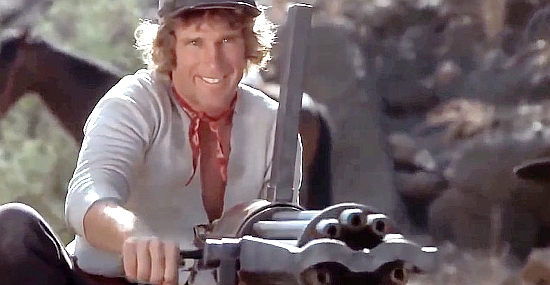 Buddy Joe Hooker as Angel, showing what a Gatling gun can do in Take a Hard Ride (1975)