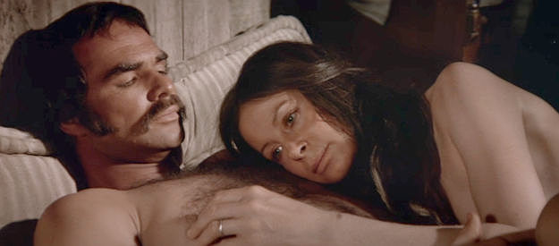 Burt Reynolds as Jay Brogart and Sarah Miles as Catherine Crocker, enjoying a tender moment in The Man Who Loved Cat Dancing (1973)