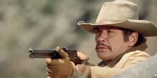 Charles Bronson as Chino Valdez, fighting to hold onto his land and his horses in Chino (1973)