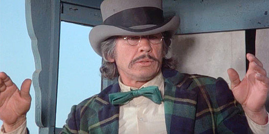 Charles Bronson as Graham Dorsey, realizing he stole the wrong man's clothing in From Noon Till Three (1975)
