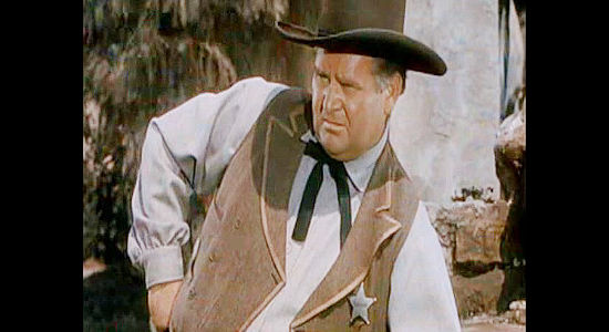 Charles Kemper as Sheriff Kiscaden, wary of Brazos Kane's presence in his town in Gunfighters (1947)