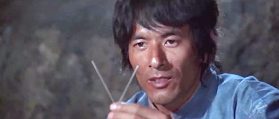 Chen Lee as Shanghai Joe, about to use acupunture to heal his wounds in The Fighting Fists of Shanghai Joe (1972)