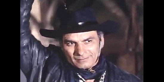 Claudio Scarchilli as Robin, one of Scaife's top guns, dousing himself with perfume to become more appealing to the gals in Taste of Death (1968)