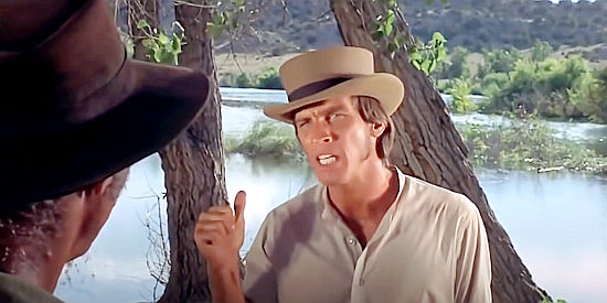 Craig Littler as Pitney, aka The Reverend, arguing for burning the barge in Barquero (1970)