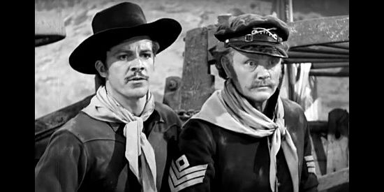 Dana Andrews as Capt. John C. Fremont and Harry Strang as Sgt. Clanahan, trapped by an Indian war party and trying to find a way out in Kit Carson (1940)