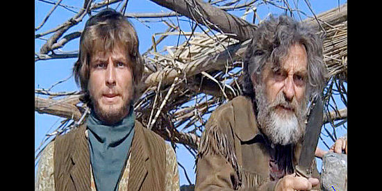 David Ladd as Caxton and Jeff Corey as Merridew, members of Catlow's gang, watching Indians approach in Catlow (1971)