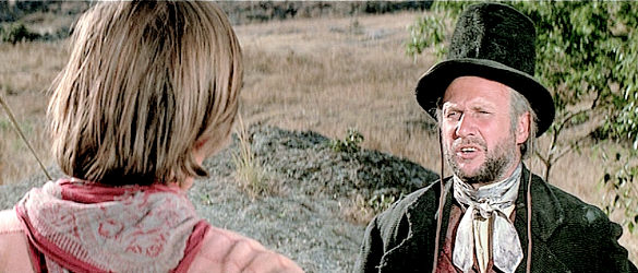 Donald Pleasence as Isaac Q. Cumber, the gun salesman Honus and Cresta stumble across in Soldier Blue (1970)