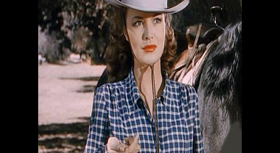 Dorothy Hart as Jane Banner, wondering why a stranger named Brazos Kane just slipped her a bullet in The Gunfighters (1947)