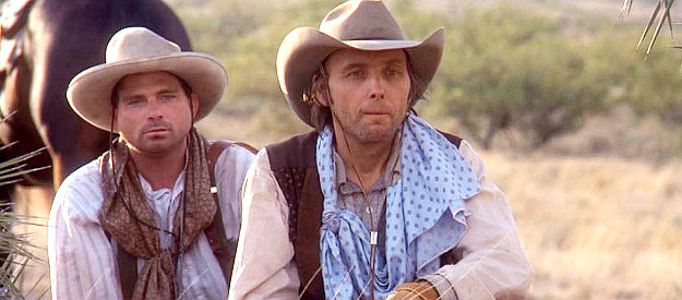 Dwight Yoakam as Valentine Casey and Terry McIlvain as U.S. Christmas, scouting out the Henry ranch in South of Heaven, West of Hell (2000)