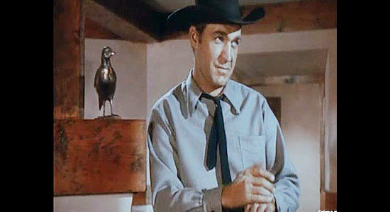 Forrest Tucker as Ben Orcutt, flipping a coin to see who gets to try Brazos Kane first in Gunfighters (1947)