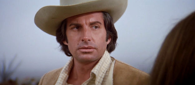 George Hamilton as Willard Crocker, vowing to kill the man who slept with his estranged wife in The Man Who Loved Cat Dancing (1973)