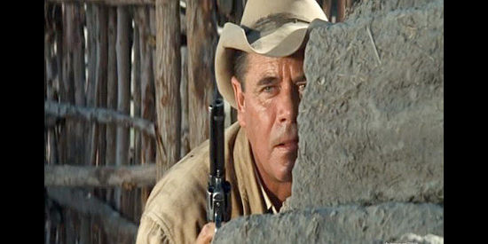 Glenn Ford as Lorne Warfield, trying to survive an Apache attack in Day of the Evil Gun (1968)