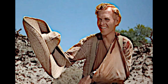 Harry Carey Jr. as William Kearney, trying to shield the infant from the sun in Three Godfathers (1948)