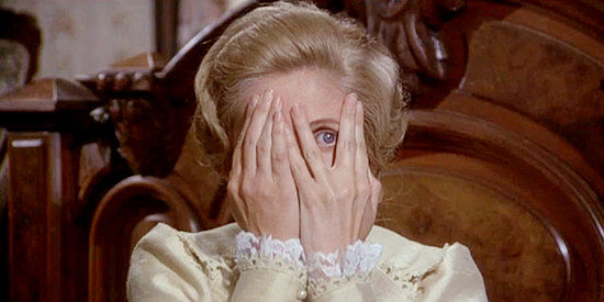 Jill Ireland as Amanda Starbuck, peeking as Graham Dorsey undoes his pants in From Noon Till Three (1975)