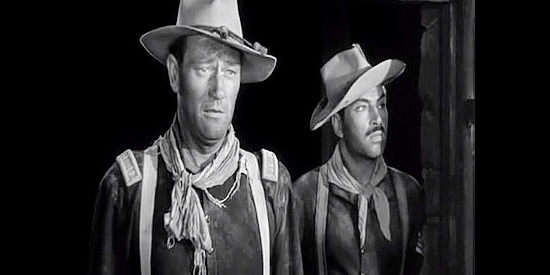 John Wayne as Capt. Kirby York and Pedro Armendariz as Sgt. Beaufort, returning from their meeting with Cochise in Fort Apache (1948)