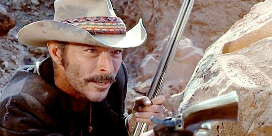 Lee Van Cleef as Jaroo, welcoming a new partner into the fold in El Condor (1970)