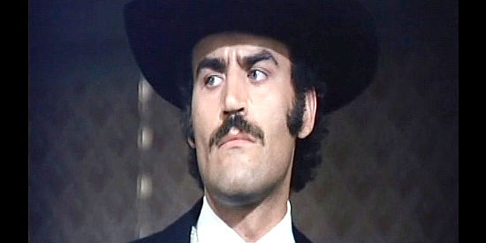 Manuel de Blas as saloon owner Palladine in Stranger and the Gunfighter (1974)