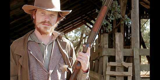 Orson Ossman as Jasper Mudd, toting a shotgun and ready to use it to maintain his freedom in The Gunfighter (2015)