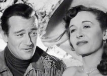John Wayne as John Breen, smitten with Fleurete de Marchand (Vera Ralston) in The Fighting Kentuckian (1949)