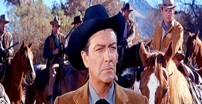 Robert Taylor as Sam Brassfield, prepared to protect his Teton range in Cattle King (1963)