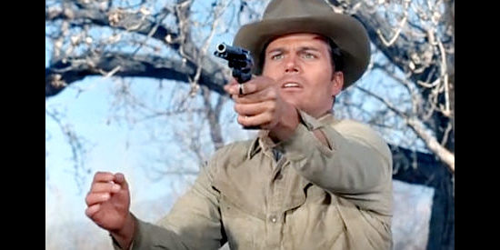 Patrick Wayne as Benny Wallace, practing shooting without his eyes in An Eye for an Eye (1966)