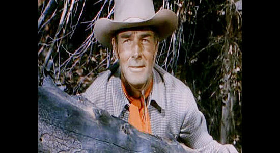 Randolph Scott as Brazos Kane, alert for an ambush as he tries to find the killer of an old friend in Gunfighters (1947)