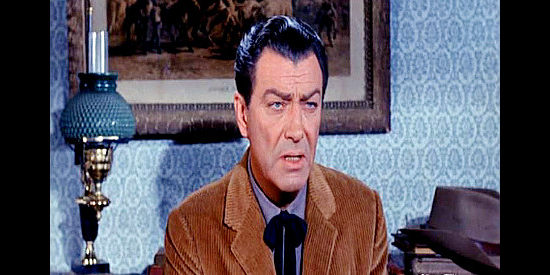 Robert Taylor as Sam Brassfield, explaining his opposition to a national cattle trail in Cattle King (1963)