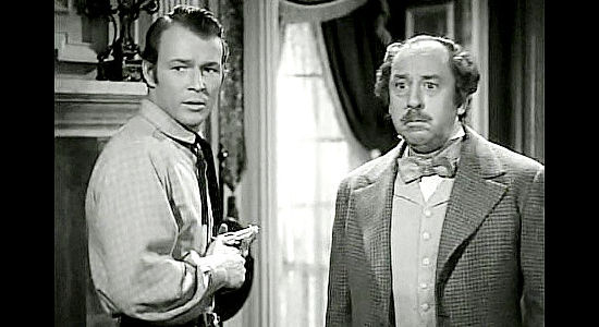 Roy Rogers as Fletch McCloud and Porter Hall as his father Angus, scolded by Mary for their constant bickering in Dark Command (1940)