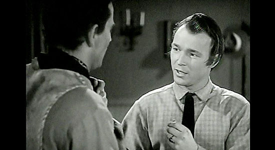 Roy Rogers as Fletch McCloud, humored by Bob Seton's plans for his older sister in Dark Command (1940)