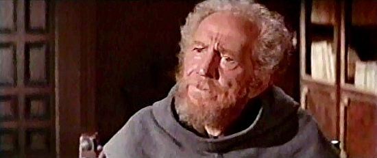 Sam Jaffe as Father Joseph, being told of his reassignment to San Sebastian in Guns for San Sebastian (1967)