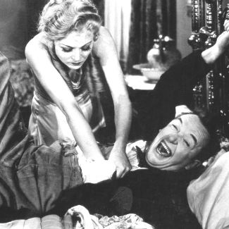 Sharon Lynn as Lola Marcel tries to get the deed from Stan Laurel in Way Out West (1937)