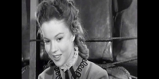 Shirley Temple as Philadelphia Thursday, stealing glimpses of Lt. O'Rourke in her hatbox mirror in Fort Apache (1948)
