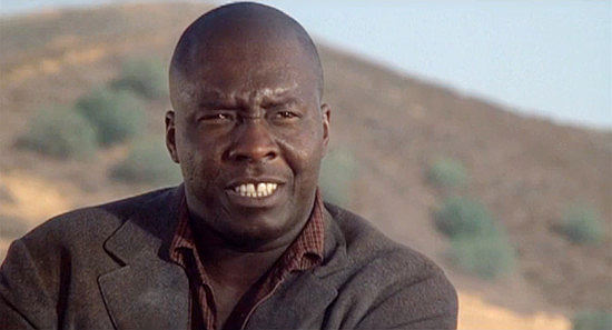 Stan Haze as Ape, a member of the Buck Bowers gang in From Noon Till Three (1975)