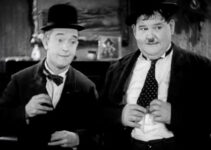Stan Laurel and Oliver Hardy, trying their best to follow the sheriff's orders in Way Out West (1937)