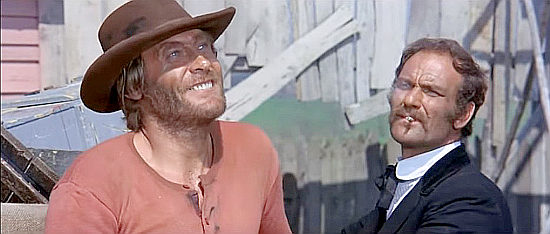 Stelio Candelli as Jeff and Benito Stefanelli as Ibanez making a gun deal in “A Man Called Django” (1972)
