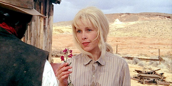 Stella Stevens as HIldy accepts a flower from Cable Hogue in The Ballad of Cable Hogue (1970)