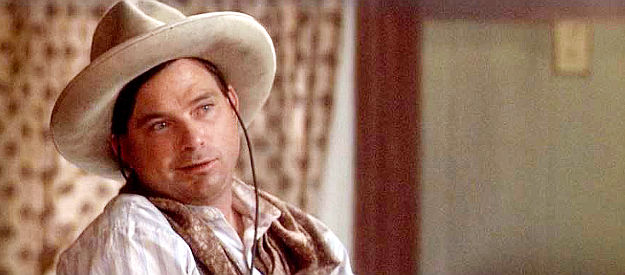 Terry McIlvain as U.S. Christmas, a man who wears a dress because it once helped him survive an Indian attack in South of Heaven, West of Hell (2000)