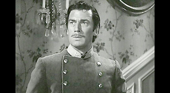 Walter Pigeon as Will Cantell, donning the uniform of a Confederate major to add a sense of legitimacy to his raids in Dark Command (1940)