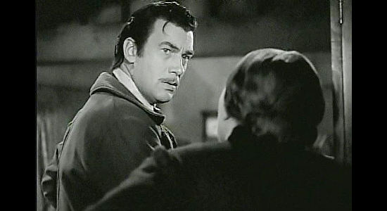 Walter Pigeon as Will Cantrell, telling his mother of his plans to make a name for himself, one way or another, in Dark Command (1940)