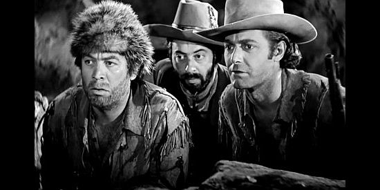 Ward Bond as Ape, Harold Huber as Lopez and Jon Hall as Kit Carson, on the watch for Indian trouble in Kit Carson (1940)