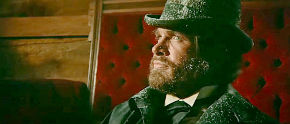 Warren Beatty as John McCabe, facing a snowy showdown with the syndicate's men in McCabe and Mrs. Miller (1971)
