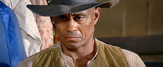 Woody Strode as Thomas, a reformed gunman who finds cause to pick up his guns again in Boot Hill (1969)