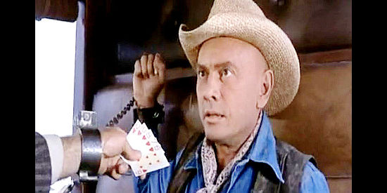 Yul Brynner as Catlow, discovering a unique way to get a peek at an opponent's poker hand in Catlow (1971)