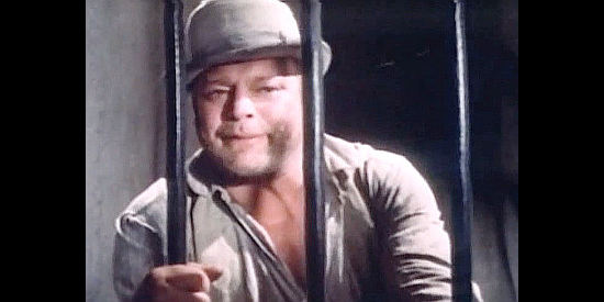 Andre Bollet as Brad McCoy, a peddler framed for a robbery and thrown in jail in Johnny West (1965)