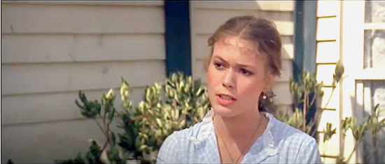 Andrea Heur as the former sheriff’s daughter, suspicious of his successor in Buddy Goes West (1981)