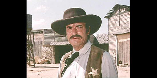 Antonio Almoros as the sheriff, hired by banker Cray to do his bidding in And Now They Call Him Sacramento (1972)