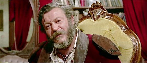 Boby Lapoint as Chapaqua, quizzing a tied-up Moira in Chapaqua's Gold (1970)
